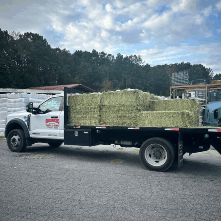 Cherokee's delivery truck stacked full of hay